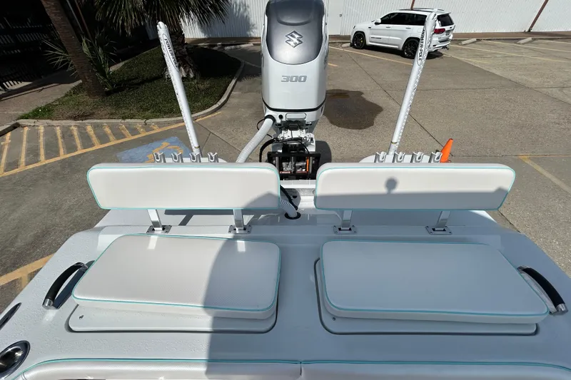 Slide: The Image of 2026 Shallow Stalker "The Boss" boat with Suzuki 300 engine in parking lot. - 7