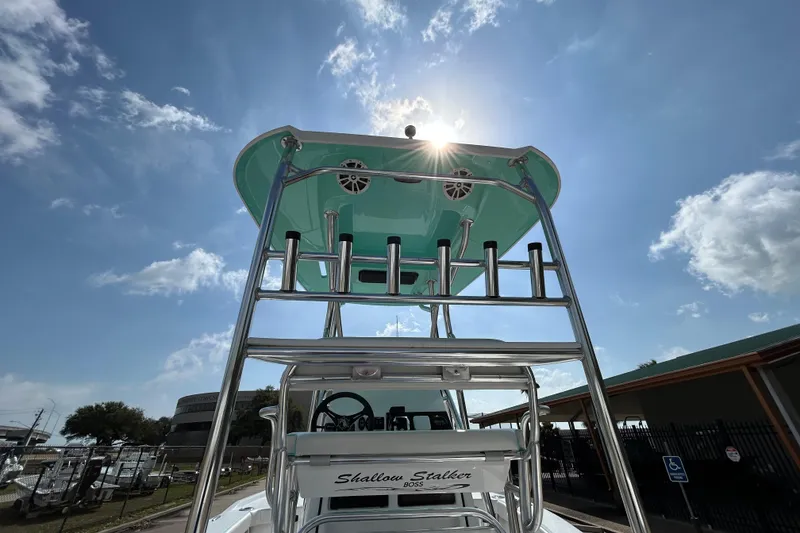 Slide: The Image of 2026 Shallow Stalker "The Boss" boat with tower under sunny sky. - 9