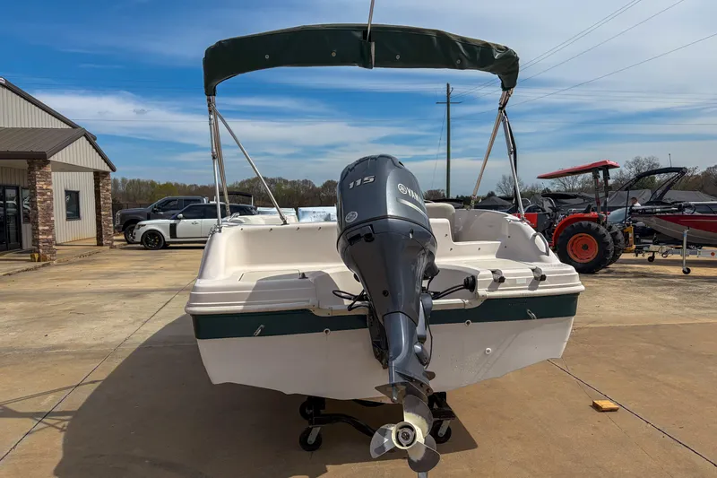 Slide: The Image of 2003 Hurricane FunDeck GS 188 OB boat with Yamaha 115 engine, parked outdoors. - 4