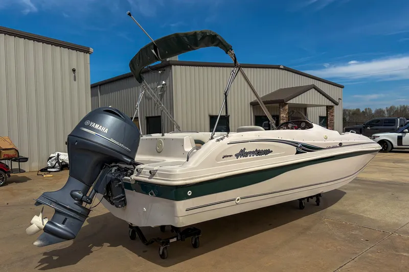 Slide: The Image of 2003 Hurricane FunDeck GS 188 OB boat with Yamaha outboard motor, parked outdoors. - 5