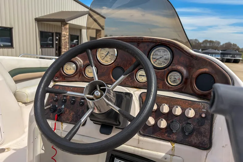 Slide: The Image of Steering console of 2003 Hurricane FunDeck GS 188 OB boat with gauges and controls. - 6