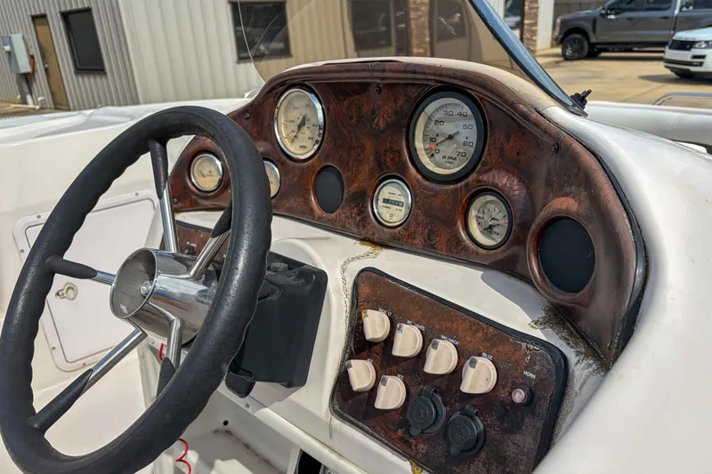 Slide: The Image of 2003 Hurricane FunDeck GS 188 OB boat dashboard with steering wheel and gauges. - 7