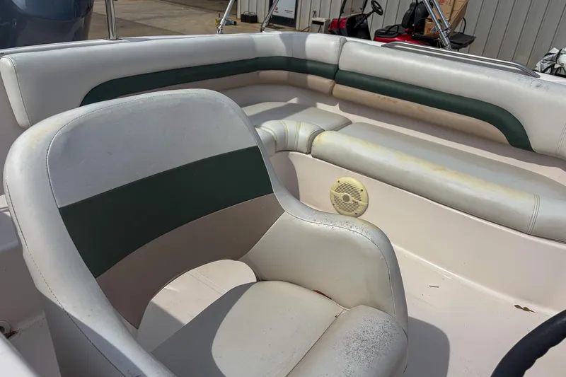 Slide: The Image of 2003 Hurricane FunDeck GS 188 OB boat interior with white and green seating. - 8