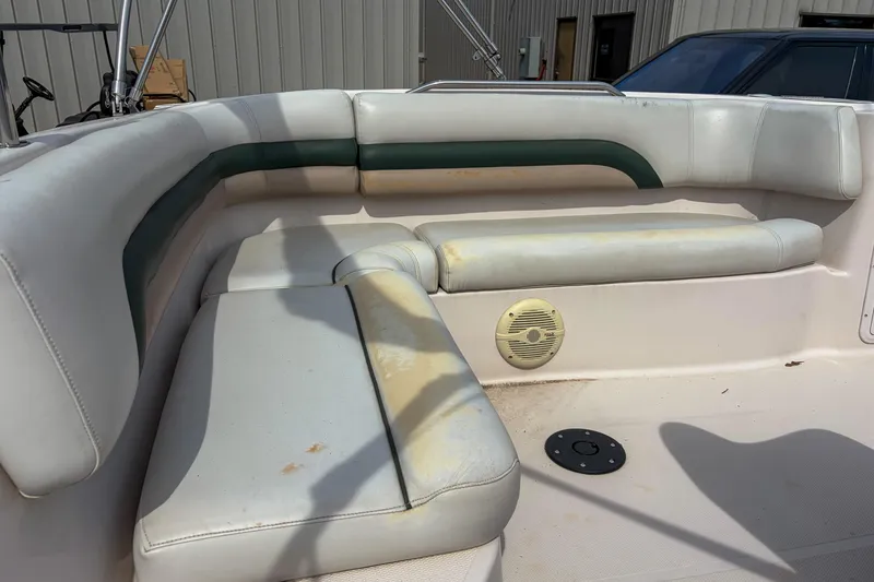Slide: The Image of 2003 Hurricane FunDeck GS 188 OB boat interior with white and green seating. - 9