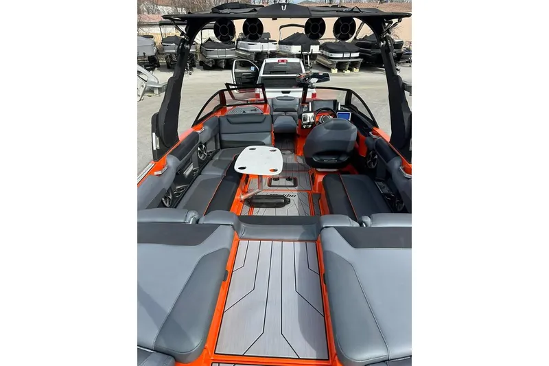 Slide: The Image of 2017 Malibu M235 boat interior with sleek seating and modern design. - 13
