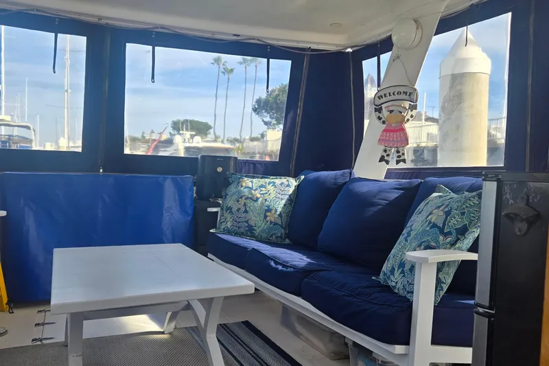 Slide: The Image of 1979 Gulfstar 44 yacht interior with wooden helm, chair, and nautical decor. - 17