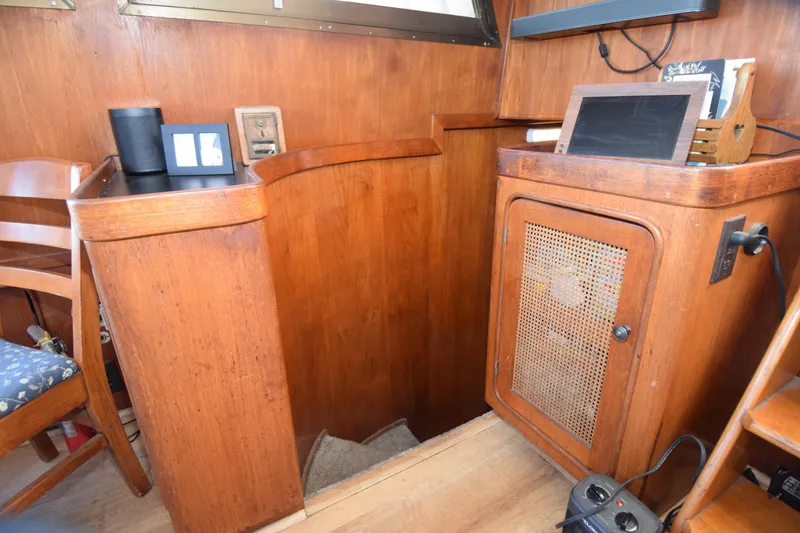 Slide: The Image of Interior of a 1979 Gulfstar 44 yacht with wooden cabinetry and seating. - 22