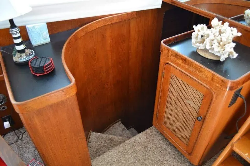 Slide: The Image of Interior of 1979 Gulfstar 44 yacht with wooden bar and stools. - 9