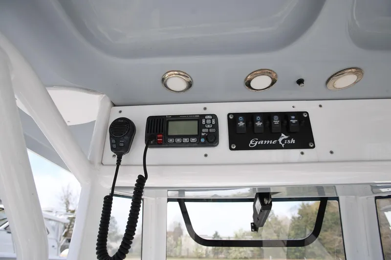 Slide: The Image of 2018 Sea Hunt Gamefish 25 console with radio and control panel. - 19