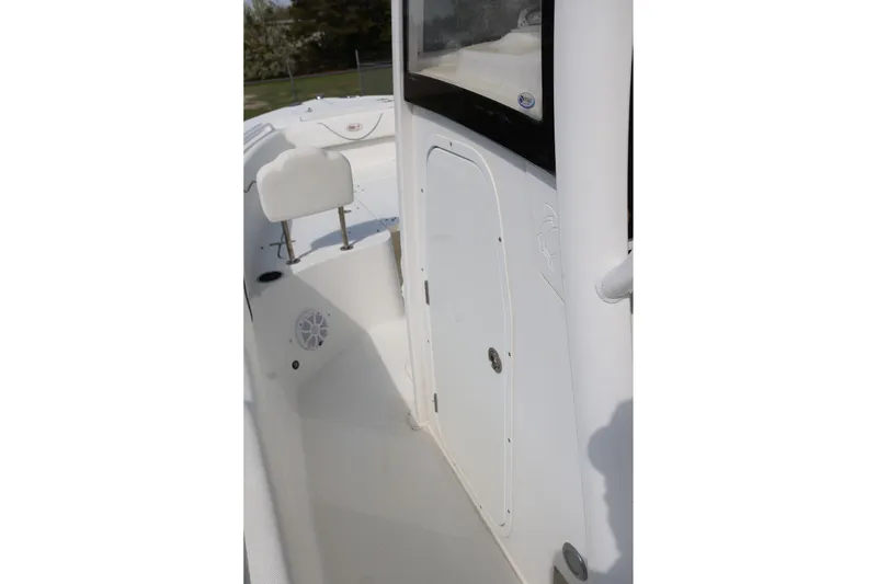 Slide: The Image of 2018 Sea Hunt Gamefish 25 boat interior with seating and storage compartment. - 20