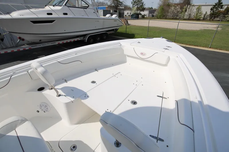 Slide: The Image of 2018 Sea Hunt Gamefish 25 boat interior, featuring spacious seating and storage compartments. - 24