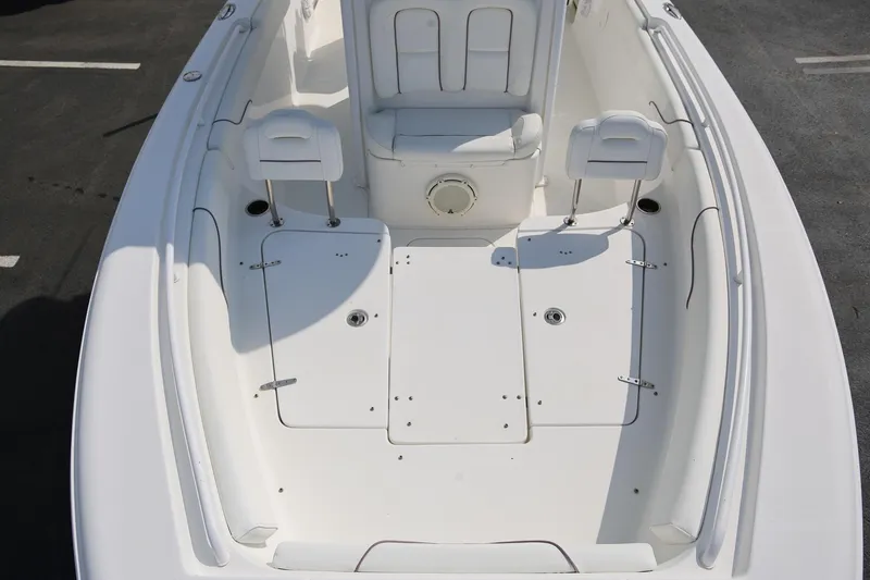 Slide: The Image of 2018 Sea Hunt Gamefish 25 boat interior with seating and storage compartments. - 25