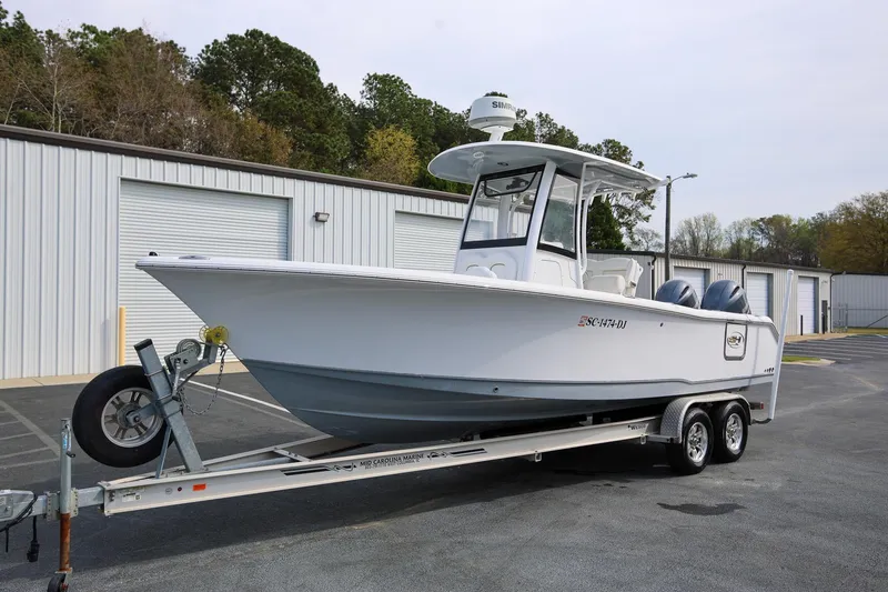 Slide: The Image of 2018 Sea Hunt Gamefish 25 boat on trailer, parked near storage facility. - 6