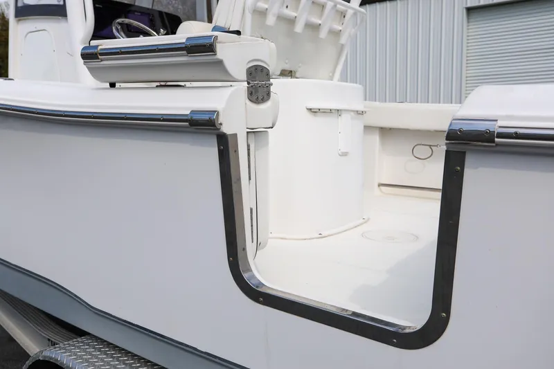 Slide: The Image of 2018 Sea Hunt Gamefish 25 boat with open side door, showcasing interior details. - 9