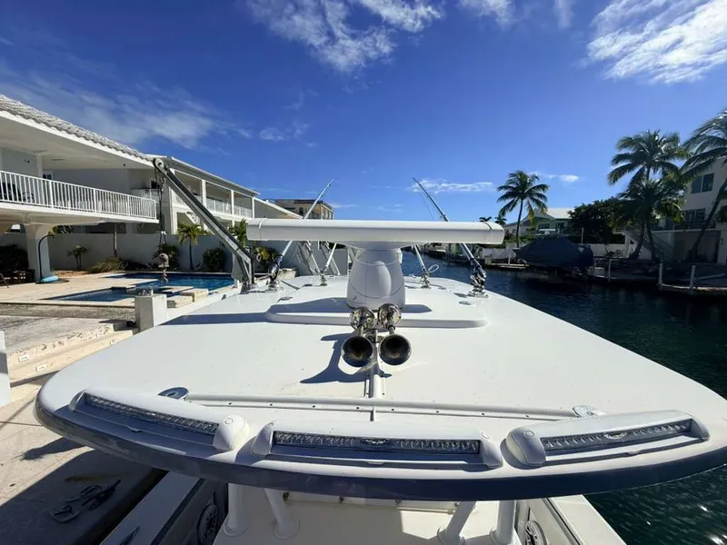 Slide: The Image of 2023 Concept 39' Open boat docked with palm trees in the background. - 18