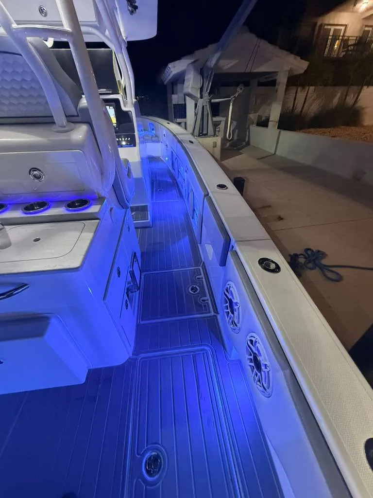 Slide: The Image of Interior view of 2023 Concept 39' Open boat with blue lighting. - 20