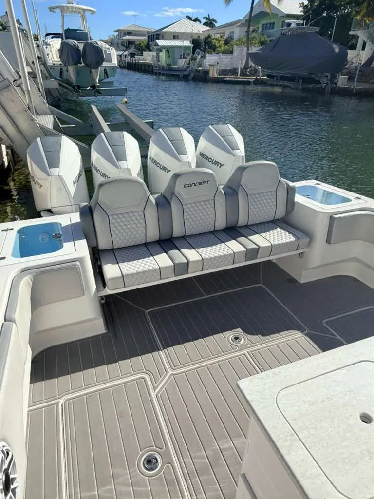 Slide: The Image of 2023 Concept 39' Open boat with four Mercury engines at dock. - 23