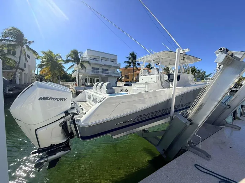 Slide: The Image of 2023 Concept 39' Open boat at dock with Mercury engine. - 24