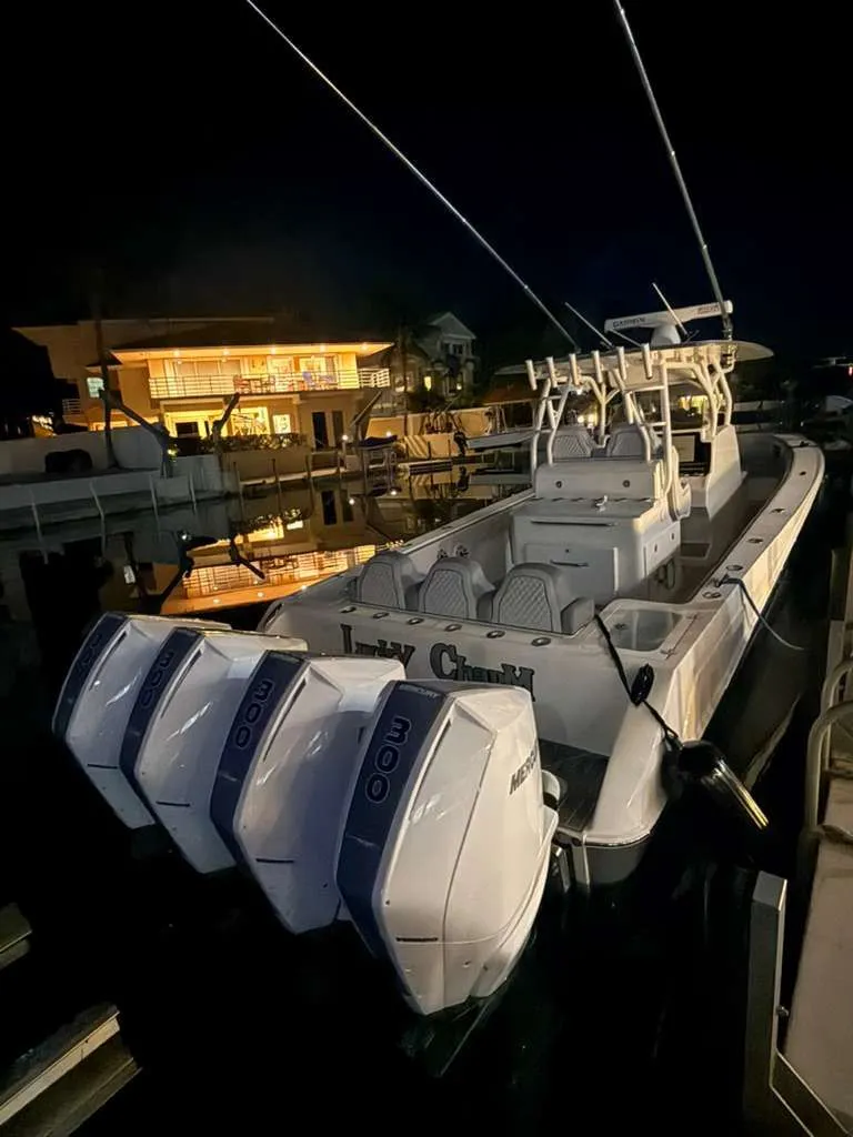 Slide: The Image of 2023 Concept 39' Open boat at night in harbor. - 25