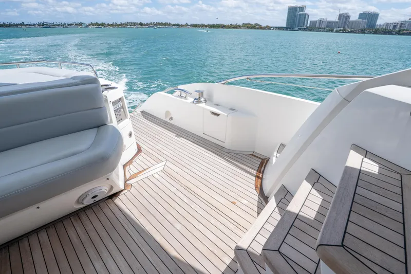 Slide: The Image of Luxurious 2014 Sunseeker 68 Sport Yacht deck with ocean view and modern seating. - 15