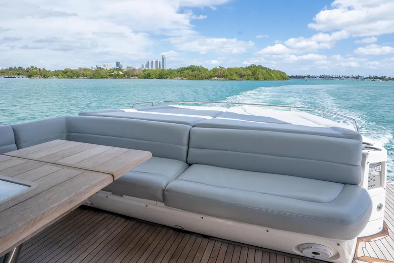 Slide: The Image of Luxurious Sunseeker 68 Sport Yacht 2014 cruising on turquoise waters, featuring elegant seating. - 19