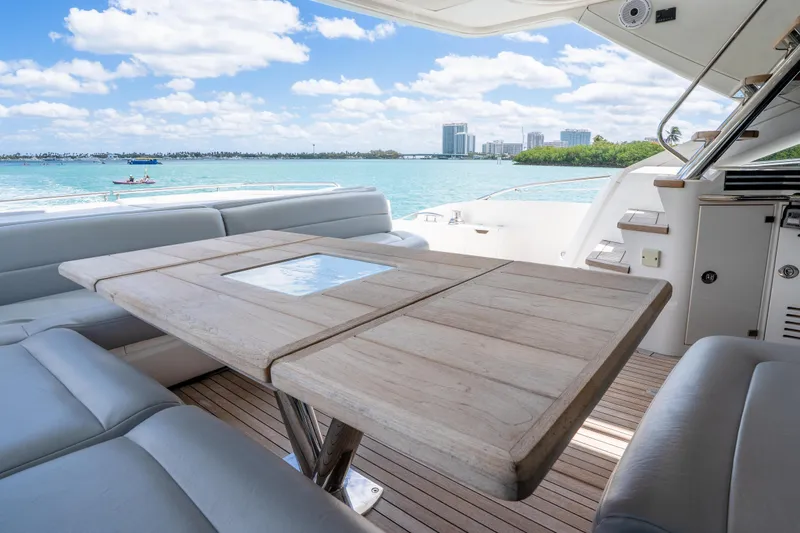 Slide: The Image of Luxurious Sunseeker 68 Sport Yacht 2014 with elegant deck seating and scenic ocean view. - 20