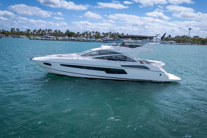Slide: The Image of 2014 Sunseeker 68 Sport Yacht cruising on clear blue waters under a partly cloudy sky. - 3