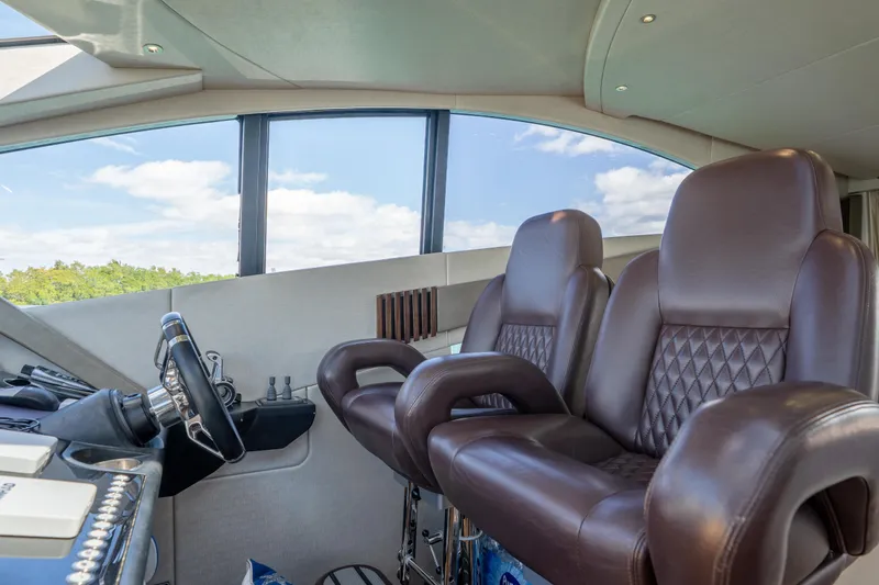 Slide: The Image of Luxurious cockpit of 2014 Sunseeker 68 Sport Yacht with leather seats and steering wheel. - 30