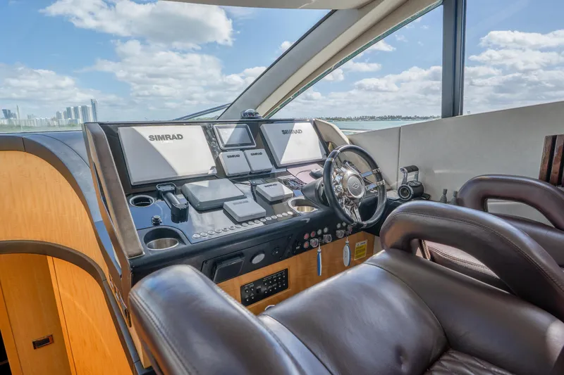 Slide: The Image of Luxurious helm of 2014 Sunseeker 68 Sport Yacht with advanced navigation systems. - 31