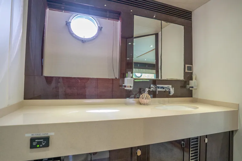 Slide: The Image of Luxurious bathroom interior of 2014 Sunseeker 68 Sport Yacht with modern fixtures and porthole window. - 42