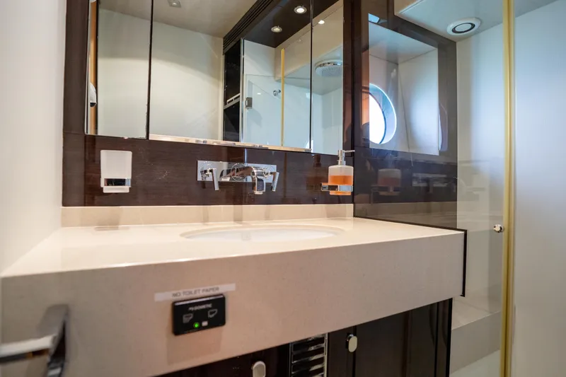 Slide: The Image of Luxurious bathroom in 2014 Sunseeker 68 Sport Yacht with modern fixtures and porthole window. - 43