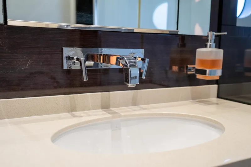 Slide: The Image of Luxurious bathroom sink on 2014 Sunseeker 68 Sport Yacht with modern chrome fixtures. - 51