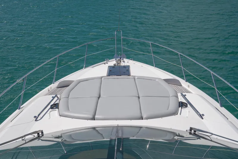 Slide: The Image of Bow view of 2014 Sunseeker 68 Sport Yacht on clear blue water. - 61