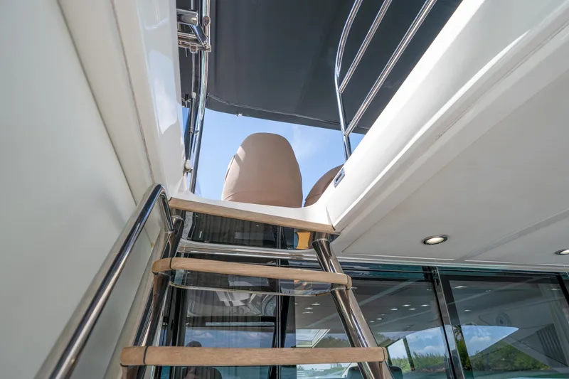 Slide: The Image of Staircase leading to upper deck of 2014 Sunseeker 68 Sport Yacht. - 62