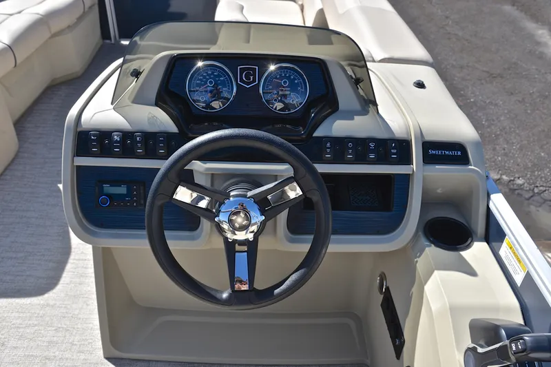 Slide: The Image of 2025 Godfrey Sweetwater 2086 C boat dashboard with steering wheel and control panel. - 25