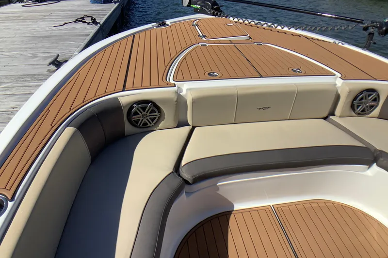 Slide: The Image of 2018 Tidewater 2700 Carolina Bay boat with tan seating and wood-style deck. - 10