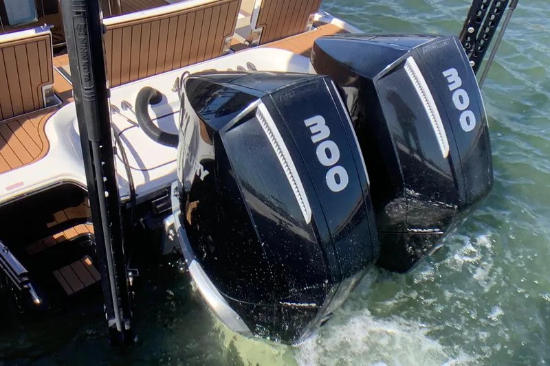 Slide: The Image of Twin 300 horsepower engines on a 2018 Tidewater 2700 Carolina Bay boat. - 15