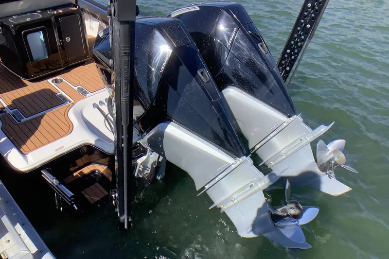 Slide: The Image of 2018 Tidewater 2700 Carolina Bay boat with dual outboard motors on water. - 16