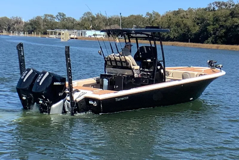 Slide: The Image of 2018 Tidewater 2700 Carolina Bay boat cruising on a calm lake. - 5