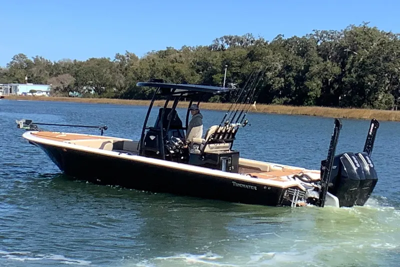 Slide: The Image of 2018 Tidewater 2700 Carolina Bay boat cruising on a scenic waterway. - 7