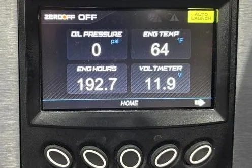 Slide: The Image of 2023 MasterCraft NXT24 dashboard displaying engine metrics: oil pressure, temperature, hours, and voltage. - 10