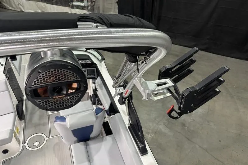 Slide: The Image of 2023 MasterCraft NXT24 boat interior with speaker and wakeboard rack. - 12