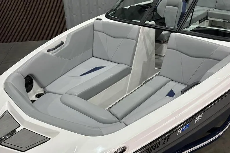 Slide: The Image of 2023 MasterCraft NXT24 boat interior with sleek gray seating and modern design. - 3
