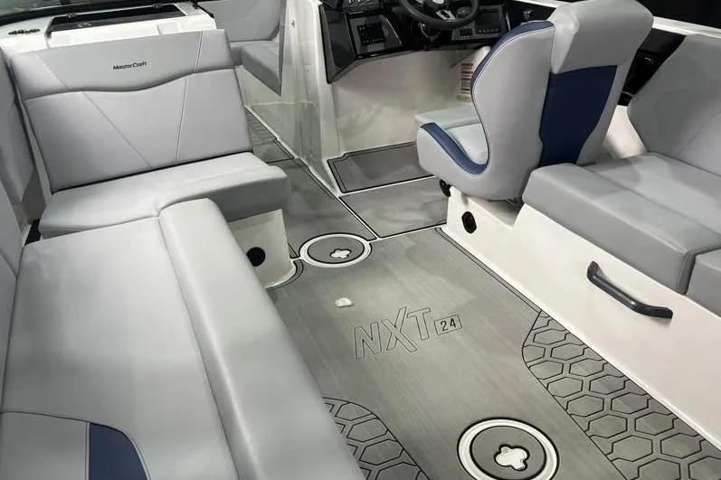 Slide: The Image of 2023 MasterCraft NXT24 boat interior with gray seating and modern design. - 6