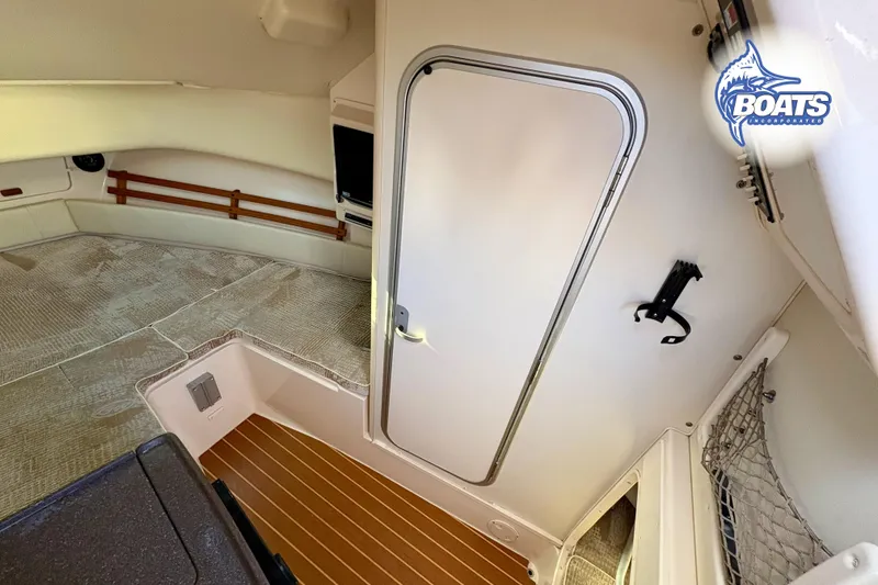 Slide: The Image of Interior cabin of 2008 Grady-White Sailfish 282 boat, featuring cozy sleeping area. - 13