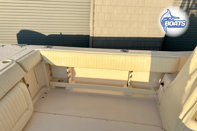 Slide: The Image of 2008 Grady-White Sailfish 282 boat interior with cushioned seating and storage compartments. - 15
