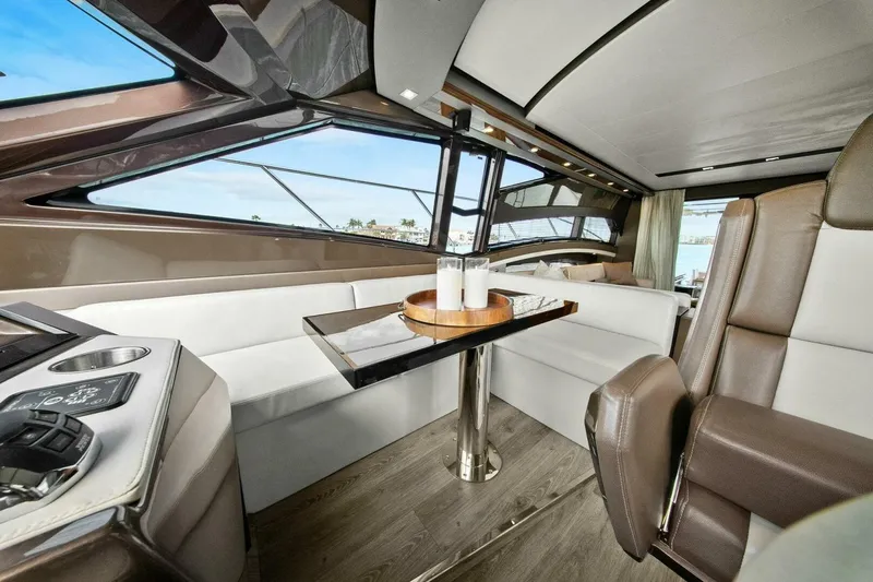 Slide: The Image of Luxurious interior of 2014 Marquis 630 Sport Yacht with elegant seating and modern design. - 10