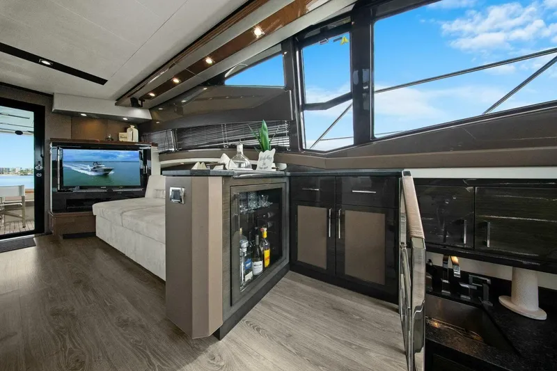 Slide: The Image of Luxurious interior of 2014 Marquis 630 Sport Yacht with modern furnishings and panoramic windows. - 12