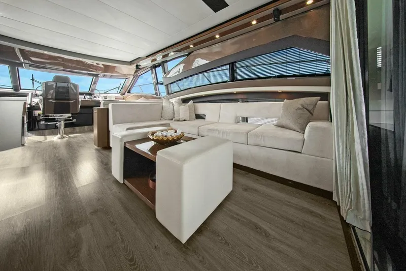 Slide: The Image of Luxurious interior of 2014 Marquis 630 Sport Yacht with modern seating and elegant decor. - 14