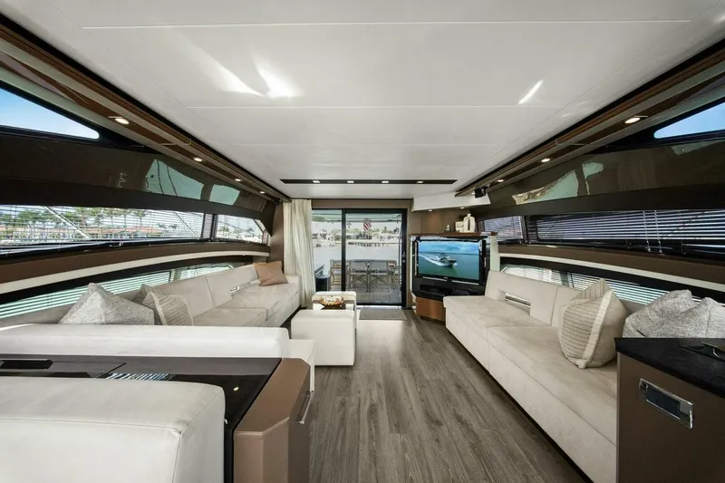 Slide: The Image of Luxurious interior of 2014 Marquis 630 Sport Yacht with modern furnishings and panoramic windows. - 17